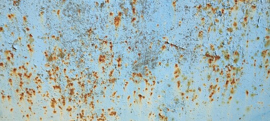 The texture of the iron panel, painted turquoise blue several times, with rust spots and paint stains. Photo, background.