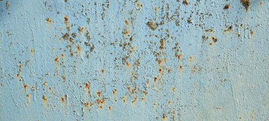 The texture of the iron panel, painted turquoise blue several times, with rust spots and paint stains. Photo, background.