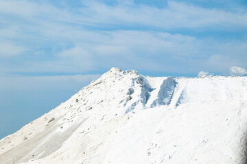 Sea salt piled up into a mountain of the salt production near the town of Aigues-Mortes in the Camarque region of France
