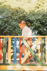 A happy child running and playing in the park.