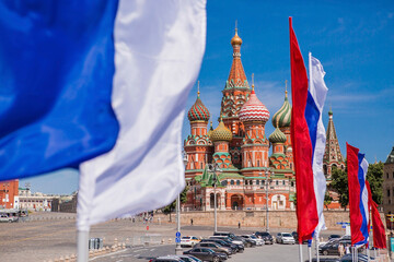Russia. Moscow. The national flag of the Russian Federation on the background of St. Basil's Cathedral on Vasilievsky Descent. Russian tricolor. The holiday is Russia Day on June 12.