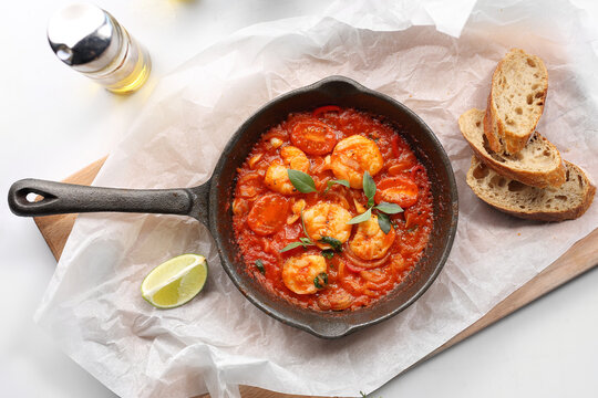 Shrimp In Tomato Sauce, In Frying Pan On Wooden Board. Prawns In Red Sauce, In Cast Iron Pan, Top View