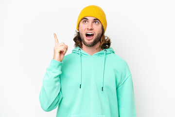 Young handsome man isolated on white chroma background thinking an idea pointing the finger up