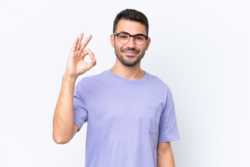 Young caucasian man isolated on white background showing ok sign with fingers - obrazy, fototapety, plakaty