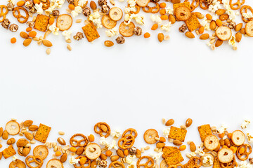 Frame of many salty snacks top view. Fast food background