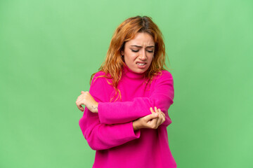 Young caucasian woman isolated on green screen chroma key background with pain in elbow