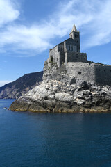 Fototapeta na wymiar Italy - Porto Venere - May 8, 2022: The Romanesque church of San Pietro is a Catholic religious building in Porto Venere under the Doria Castle. It is the oldest church in the Gulf of poets.