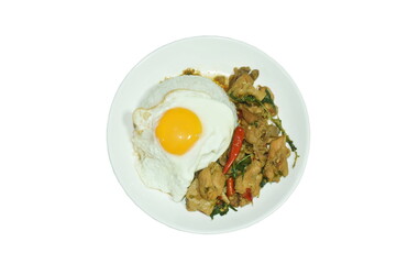 spicy stir-fried chicken meat and gizzard with basil on rice topping egg in plate