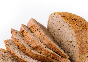 Black bread with seeds on white