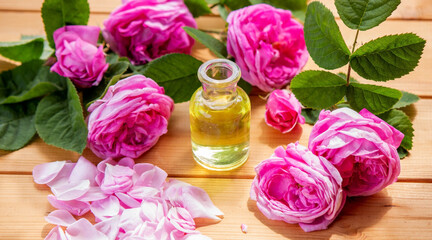 Obraz na płótnie Canvas rose flower and essential oil. spa and aromatherapy