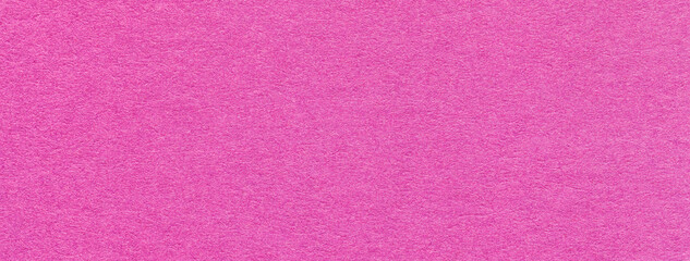 Fototapeta premium Texture of old purple color paper background, macro. Structure of a vintage craft magenta cardboard.
