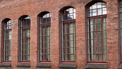 old industrial brick building with windows