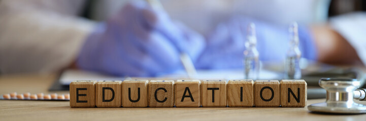 Word education collected of wooden blocks in raw