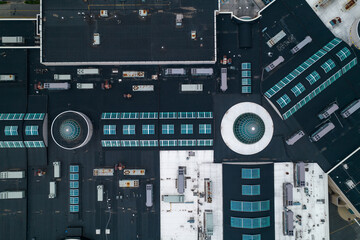 Drone shot of a commercial rooftop with glass windows