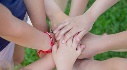 children, friends are playing in the garden, holding hands.