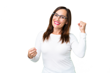 Middle age woman over isolated chroma key background celebrating a victory