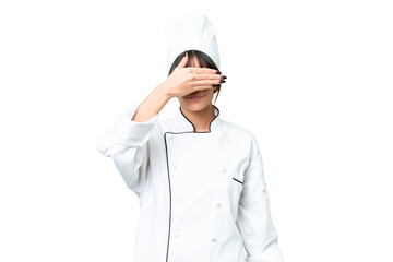 Young caucasian chef  woman over isolated chroma key background covering eyes by hands. Do not want to see something