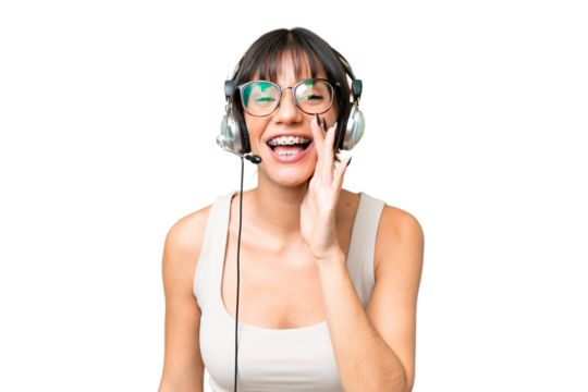 Telemarketer caucasian woman working with a headset over isolated background shouting with mouth wide open