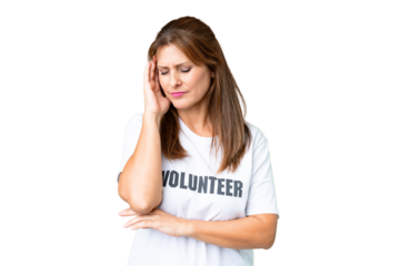 Middle age volunteer woman over isolated background with headache