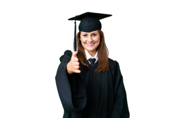 Middle age university graduate woman over isolated background shaking hands for closing a good deal