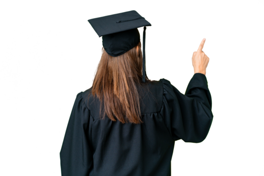 Middle age university graduate woman over isolated background pointing back with the index finger
