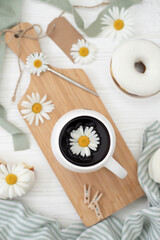 Fresh baked goods in a cooking container on the table and cutlery