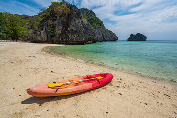 Kayaking on a lonely sandy beach on an island in Myanmar with crystal clear waters. and clear weather in the midst of natureKayaking on a lonely sandy beach on an island in Myanmar with crystal clear