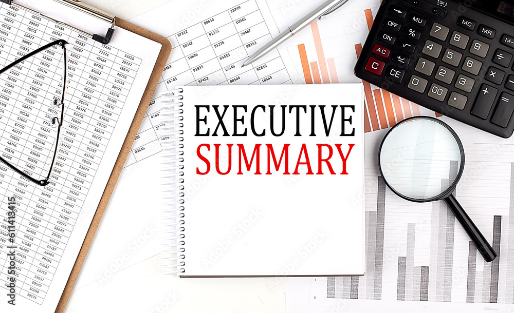 Poster executive summary text on notebook with clipboard and calculator on a chart background