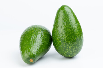 Two fresh clean avocado