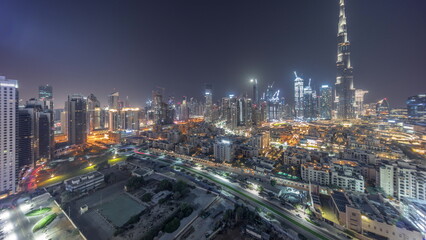 Fototapeta na wymiar Dubai Downtown all night timelapse with tallest skyscraper and other towers