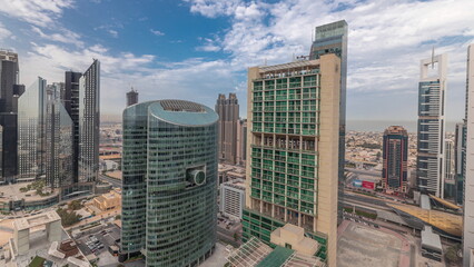 Panorama showing Dubai international financial center skyscrapers with promenade on a gate avenue aerial timelapse.