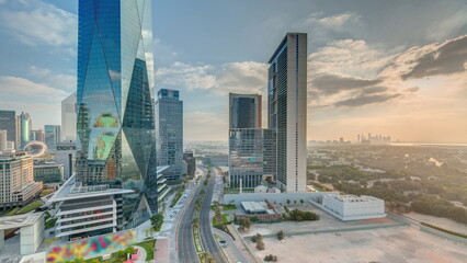 Dubai International Financial district aerial night to day timelapse. Panoramic view of business...