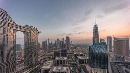 Futuristic Dubai Downtown and finansial district skyline aerial night to day timelapse.