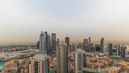Fototapeta premium Aerial panoramic skyline of a big futuristic city timelapse. Business bay and Downtown