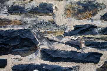Background of ancient stones in Germany. The texture of the stones.