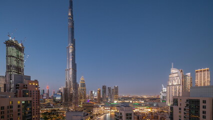 Fototapeta na wymiar Dubai Downtown cityscape with tallest skyscrapers around aerial day to night timelapse.