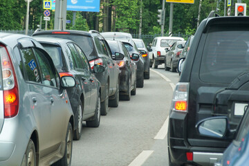 Traffic jam in the city. Rear view of two rows of cars.