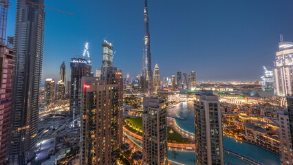 Naklejka premium Panorama of Dubai Downtown cityscape with tallest skyscrapers around aerial day to night timelapse.