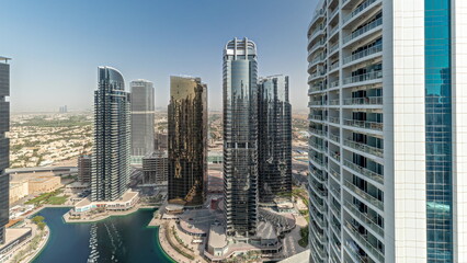 Panorama showing tall residential buildings at JLT aerial timelapse, part of the Dubai multi...