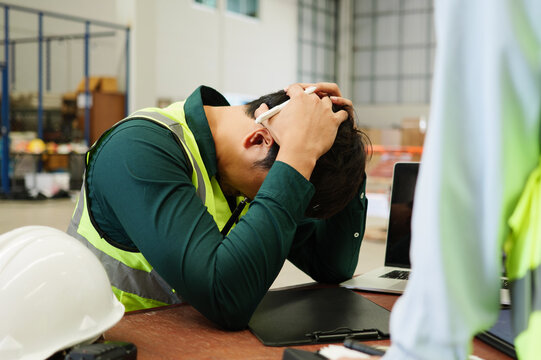 Portrait Of Sad Man Warehouse Worker With Problem