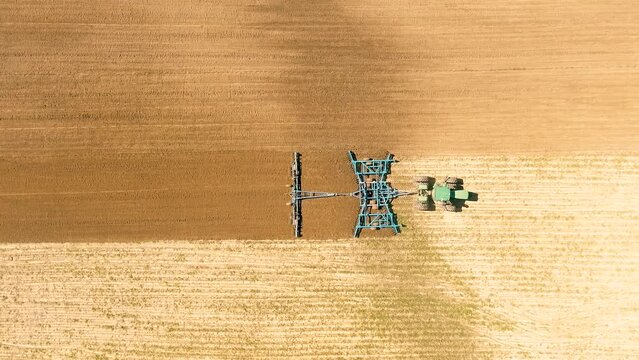 Drone Video of Tractor Plowing Field Top Down 2