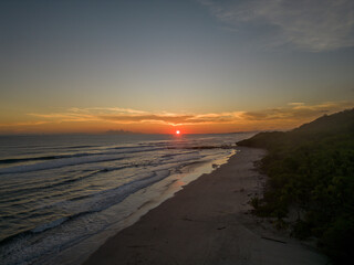 Fototapeta na wymiar Sunset with red horizon in Santa Teresa (Costa Rica).