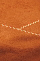 tennis court made of red clay soil with markings for game or competition. sports and recreation, professional performance champions in lawn tennis with rackets and balls. training of athletes outdoor