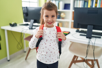 Adorable hispanic girl student smiling confident standing at classroom