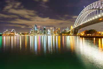 Fototapeta premium A symphony of design and engineering: Sydney's iconic Opera House and Harbour Bridge.