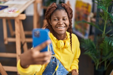 African american woman artist make selfie by smartphone at art studio