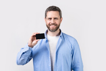 happy man with business card in studio. man holding business card.
