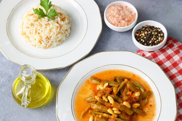 Homemade stewed green beans, tomatoes, garlic with olive oil. Zeytinyagli fasulye traditional food. Turkish cuisine.