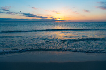 Fototapeta na wymiar beautiful sunset with mediterranean sea water on the summer beach
