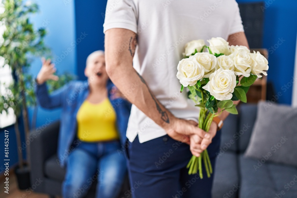 Canvas Prints Mother and son surprise with flowers at home